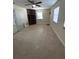 Living room with tile flooring, built-in shelving and ceiling fan at 7852 Murcott Cir, Orlando, FL 32835