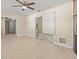 Open living area with tile floors and sliding glass doors at 7852 Murcott Cir, Orlando, FL 32835