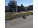 Residential street view with a community sign at 7852 Murcott Cir, Orlando, FL 32835