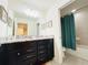 Bathroom with granite countertops and double vanity at 8902 Sydney Ave, Kissimmee, FL 34747