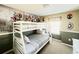 Bedroom with a bunk bed and a superhero mural at 8902 Sydney Ave, Kissimmee, FL 34747