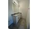 Bathroom with granite countertop, double vanity, and modern fixtures at 8944 Sw 128Th Pl, Ocala, FL 34473