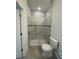 Modern bathroom with a large shower and toilet at 8944 Sw 128Th Pl, Ocala, FL 34473