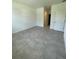 Spacious bedroom with tile flooring and access to a private bathroom at 8944 Sw 128Th Pl, Ocala, FL 34473