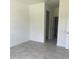 Bright bedroom with tile flooring and en-suite bathroom at 8944 Sw 128Th Pl, Ocala, FL 34473