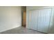 Bright bedroom with tile flooring and built-in closet at 8944 Sw 128Th Pl, Ocala, FL 34473