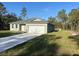 New construction home with a driveway and grassy yard at 8944 Sw 128Th Pl, Ocala, FL 34473