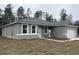 Newly constructed one-story home with gray siding and landscaping at 8944 Sw 128Th Pl, Ocala, FL 34473