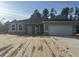 Newly built home featuring gray siding and a two-car garage at 8944 Sw 128Th Pl, Ocala, FL 34473