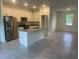 Modern kitchen with white cabinets, granite countertops, and stainless steel appliances at 8944 Sw 128Th Pl, Ocala, FL 34473