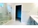 Bathroom featuring a glass shower and a walk-in closet at 922 Umbria Dr, Poinciana, FL 34759