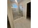 Bathroom with a large walk-in shower and tile floors at 922 Umbria Dr, Poinciana, FL 34759