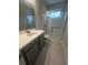 Bathroom with single vanity and walk-in shower at 922 Umbria Dr, Poinciana, FL 34759