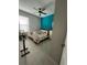 Bedroom with a queen bed and teal accent wall at 922 Umbria Dr, Poinciana, FL 34759