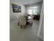 Dining room featuring a round table, six chairs and a sideboard at 922 Umbria Dr, Poinciana, FL 34759