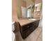 Bathroom with dark brown vanity and single sink at 975 Gascony Ct, Kissimmee, FL 34759