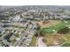 Aerial view of houses, golf course, and community at 9856 Heron Pointe Dr, Orlando, FL 32832