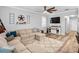 Relaxing living room featuring a large sectional sofa and a neutral color scheme at 9856 Heron Pointe Dr, Orlando, FL 32832