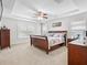 Spacious main bedroom with a king-size bed and ample natural light at 9856 Heron Pointe Dr, Orlando, FL 32832