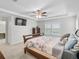 Main bedroom with king bed, TV, and ensuite bathroom access at 9856 Heron Pointe Dr, Orlando, FL 32832