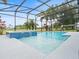 Inviting pool and spa area with a screened enclosure at 9856 Heron Pointe Dr, Orlando, FL 32832