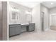 Double vanity bathroom with gray cabinets and quartz countertop at Tbd Sw 93 St, Dunnellon, FL 34432