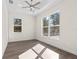 Bright bedroom with wood-look flooring and large windows at Tbd Sw 93 St, Dunnellon, FL 34432