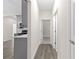 Bright hallway with grey cabinets and wood-look flooring at Tbd Sw 93 St, Dunnellon, FL 34432