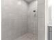 Spacious walk-in shower with gray tile and rainfall shower head at Tbd Sw 93 St, Dunnellon, FL 34432