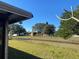 Backyard view showing canal and neighboring houses at 102 San Blas Ave, Kissimmee, FL 34743