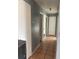 Gray hallway with tile flooring and multiple doors at 102 San Blas Ave, Kissimmee, FL 34743