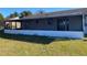 Screened patio with a freshly painted white wall at 102 San Blas Ave, Kissimmee, FL 34743