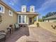 Brick paved courtyard with seating area and potted plants at 107 Cupania Ct, Groveland, FL 34736