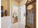 Hallway with view into bedroom and bathroom at 107 Cupania Ct, Groveland, FL 34736