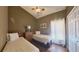 Bedroom with twin beds and ceiling fan at 1138 Mariner Cay Dr, Haines City, FL 33844