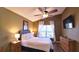 Main bedroom with a queen bed and ceiling fan at 1138 Mariner Cay Dr, Haines City, FL 33844