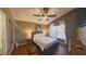 Bright bedroom with a queen-size bed and wood flooring at 1138 Mariner Cay Dr, Haines City, FL 33844