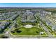This aerial shot features a community surrounded by green spaces, reflecting a serene residential setting at 11526 Comic Aly, Orlando, FL 32832