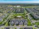 Discover a beautifully planned community from above, with its green spaces and orderly residential layout at 11526 Comic Aly, Orlando, FL 32832