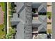 An aerial view captures a residential community, revealing rooftops, private courtyards, and well-kept grounds at 11526 Comic Aly, Orlando, FL 32832