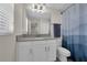 Well-lit bathroom featuring a vanity with gray countertop, white cabinets, and a toilet at 11526 Comic Aly, Orlando, FL 32832