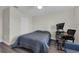 This bedroom is a cozy retreat, featuring neutral walls and durable laminate flooring at 11526 Comic Aly, Orlando, FL 32832