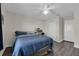 Cozy bedroom featuring wood floors, closet, and neutral decor, perfect for relaxation and comfort at 11526 Comic Aly, Orlando, FL 32832