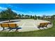 Inviting community space with benches, landscaping, and common area for relaxing and socializing at 11526 Comic Aly, Orlando, FL 32832