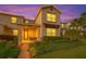 Charming home showcasing manicured landscaping, a brick walkway, and a welcoming front porch area for relaxing at 11526 Comic Aly, Orlando, FL 32832