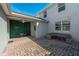 Relax on this beautiful brick-paved patio, complete with furniture, ceiling fan, and a unique green wall at 11526 Comic Aly, Orlando, FL 32832