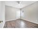 Third bedroom with wood-look floors and ceiling fan at 116 Whispering Pines Way, Davenport, FL 33837