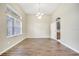 Formal dining room with hardwood floors and chandelier at 116 Whispering Pines Way, Davenport, FL 33837