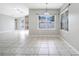 Dining area with tile flooring and a view into the living room at 116 Whispering Pines Way, Davenport, FL 33837