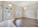 Bright and airy foyer with hardwood and tile flooring at 116 Whispering Pines Way, Davenport, FL 33837